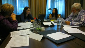 Delegates around a table at Unit writing training for PDA Software Development 