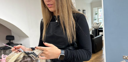 High school pupil Ria working at a hair salon