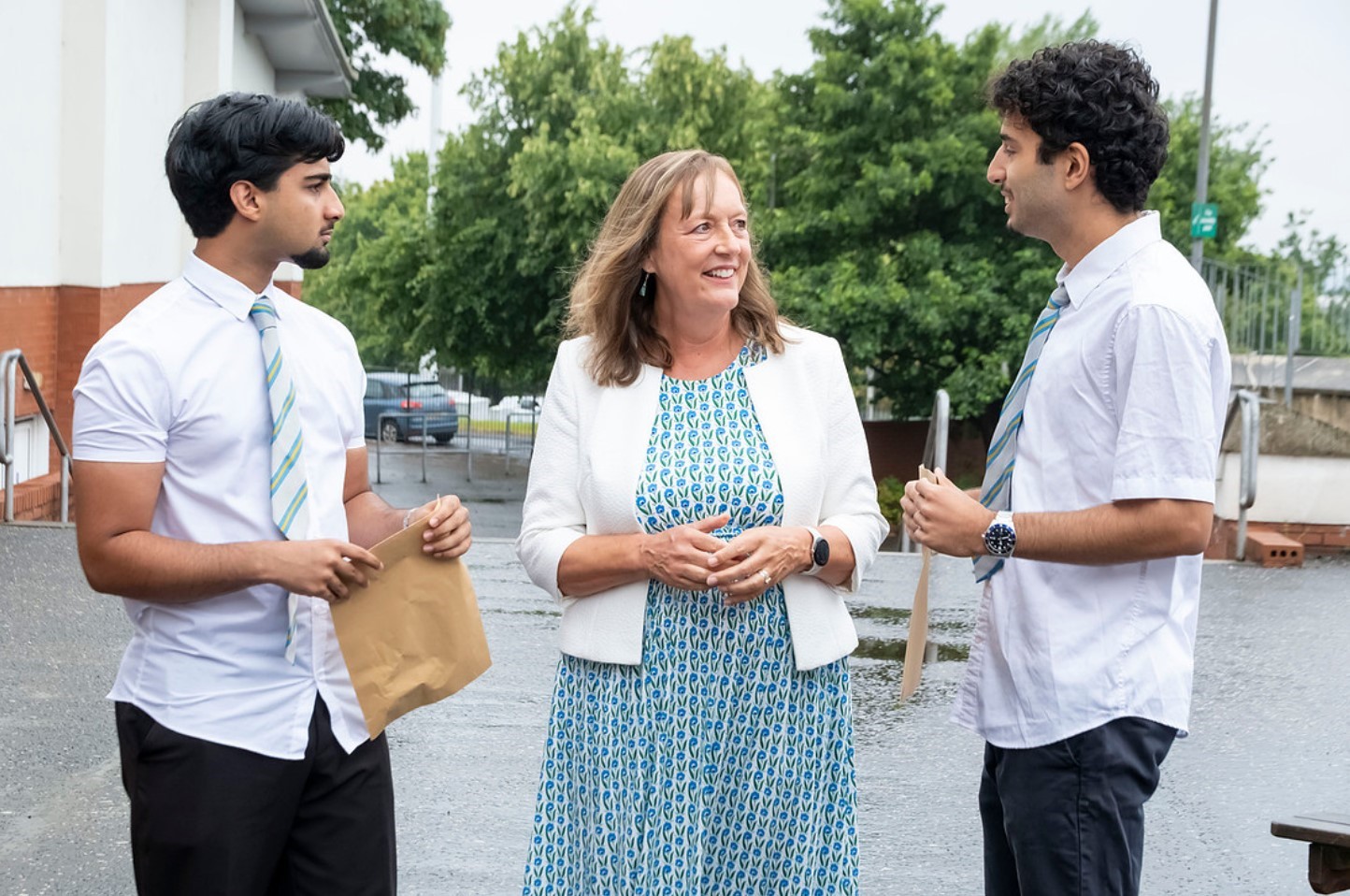 Sarah Brown chatting to two school learners