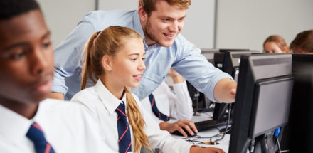 Pupil and teacher in classroom