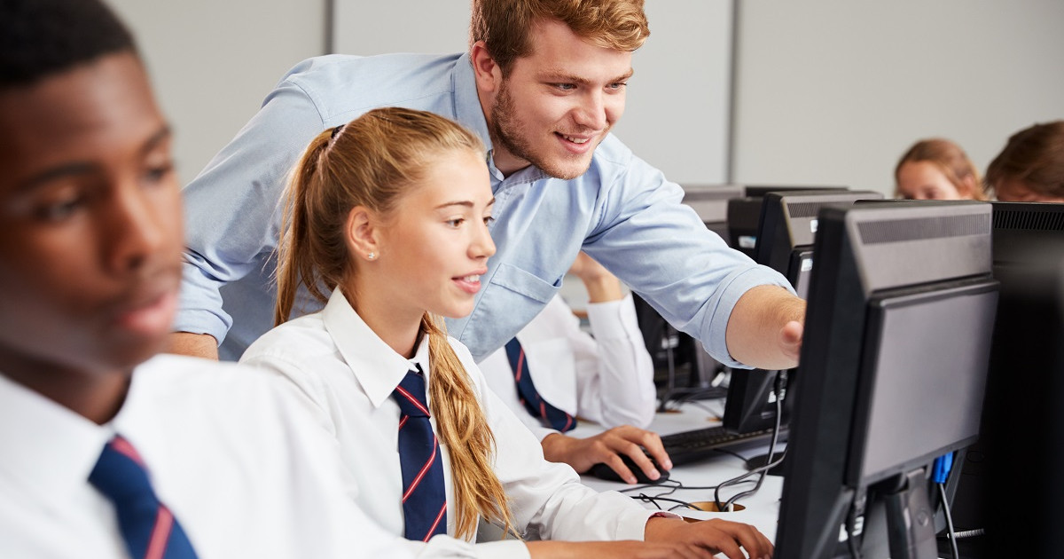 Pupil and teacher in classroom