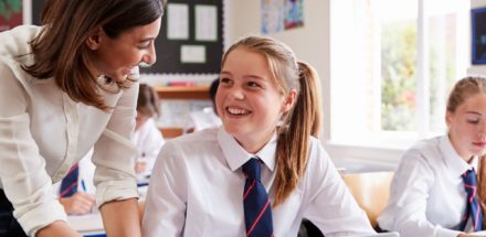 Pupil and teacher in a classroom